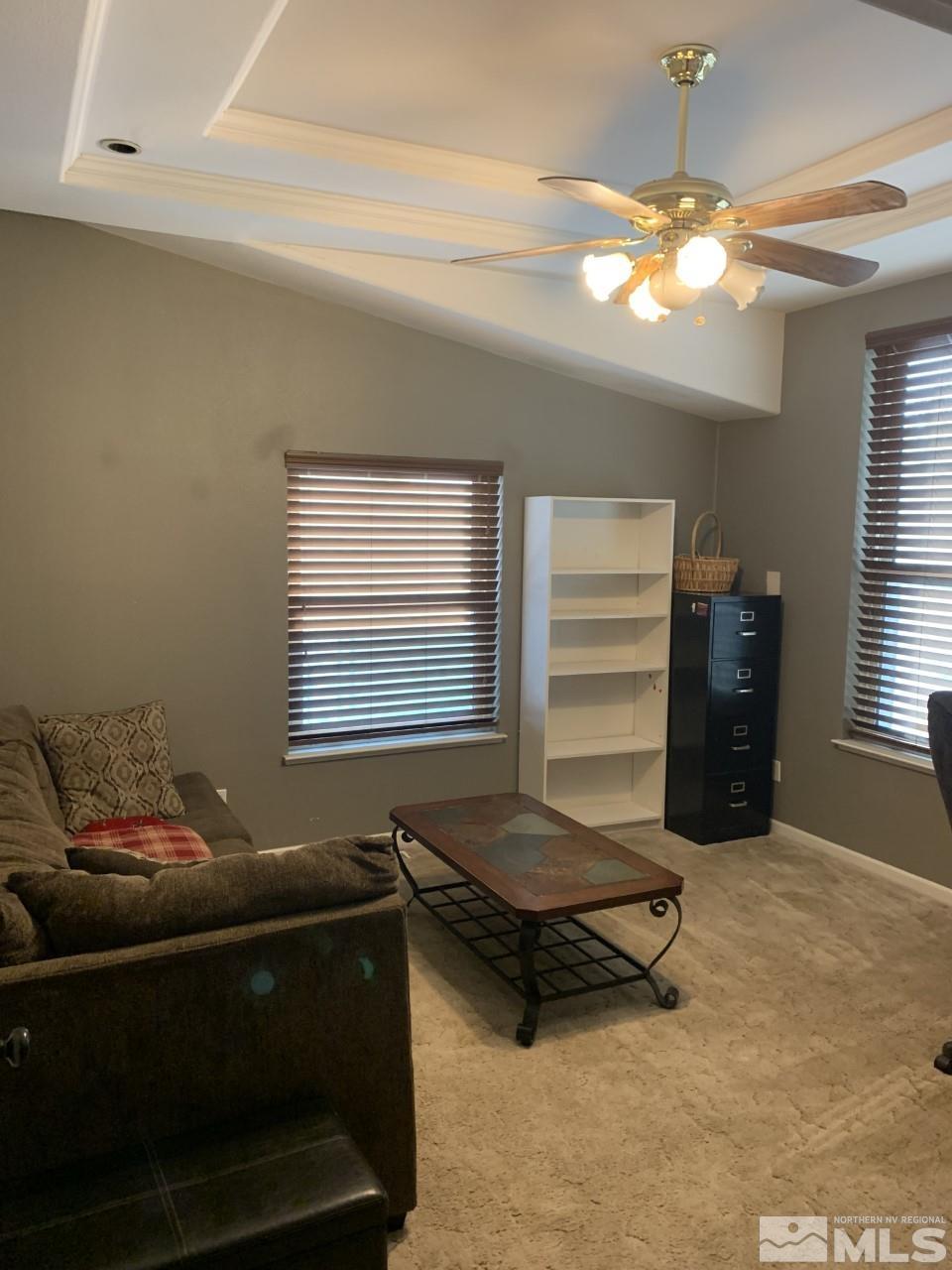 450 Reservoir Road Lovelock, NV 89419 - Photo 7 of 37 a living room with furniture and a chandelier
