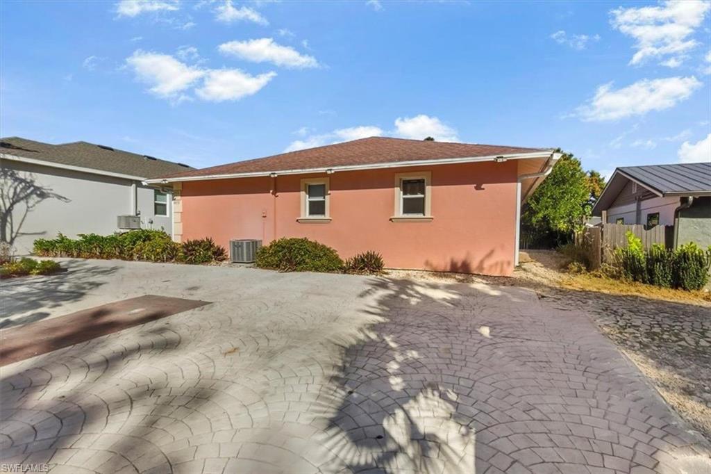 4438 Pine Lake Road Bonita Springs, FL 34134 - Photo 28 of 33 a front view of a house with a yard