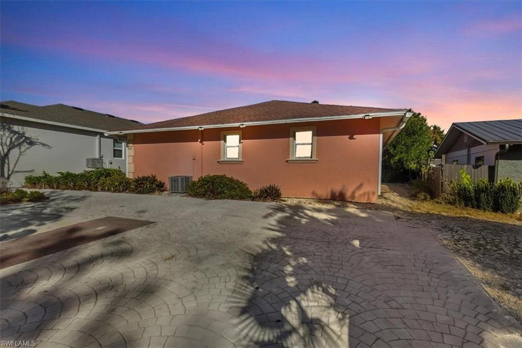 4438 Pine Lake Road Bonita Springs, FL 34134 - Photo 29 of 33 a front view of a house with a yard