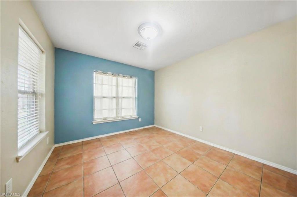 4438 Pine Lake Road Bonita Springs, FL 34134 - Photo 8 of 33 a view of an empty room with a window