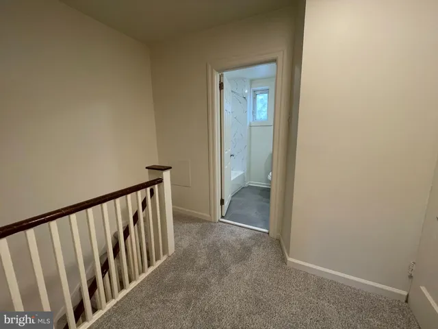 a view of a hallway with a door