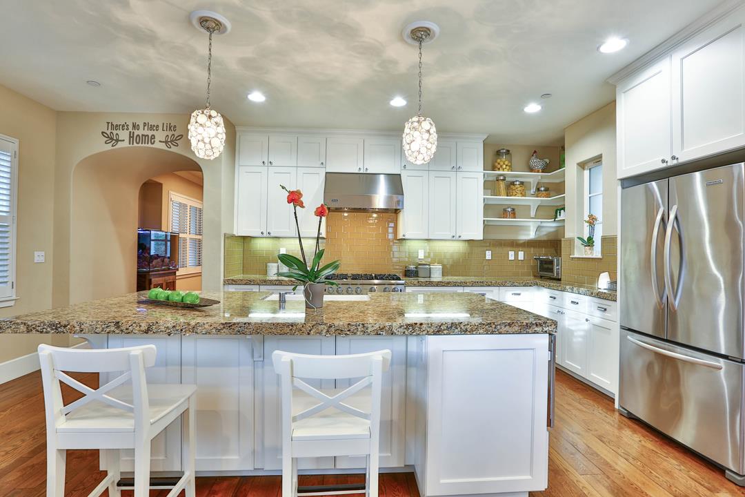 103 Savannah Loop Mountain View, CA 94043 - Photo 18 of 35 a large kitchen with granite countertop a stove a sink and a refrigerator