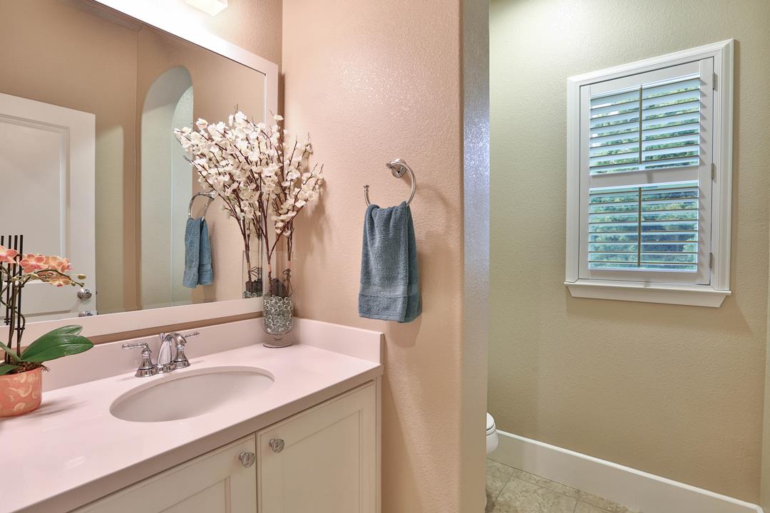 103 Savannah Loop Mountain View, CA 94043 - Photo 22 of 35 a bathroom with a granite countertop sink and a mirror