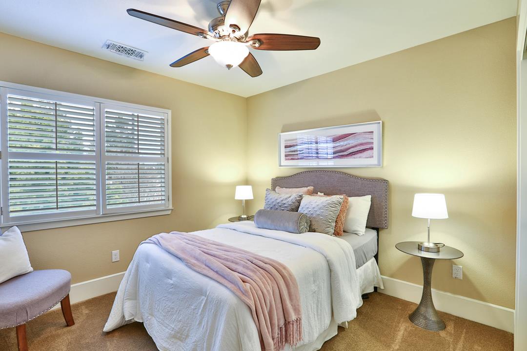 103 Savannah Loop Mountain View, CA 94043 - Photo 27 of 35 a bedroom with a bed and a chandelier