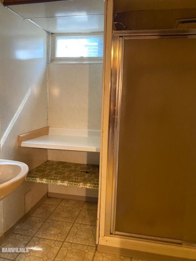6389 C Riverview Road Thomson, IL 61285 - Photo 11 of 16 a view of bathroom with a shower and a toilet