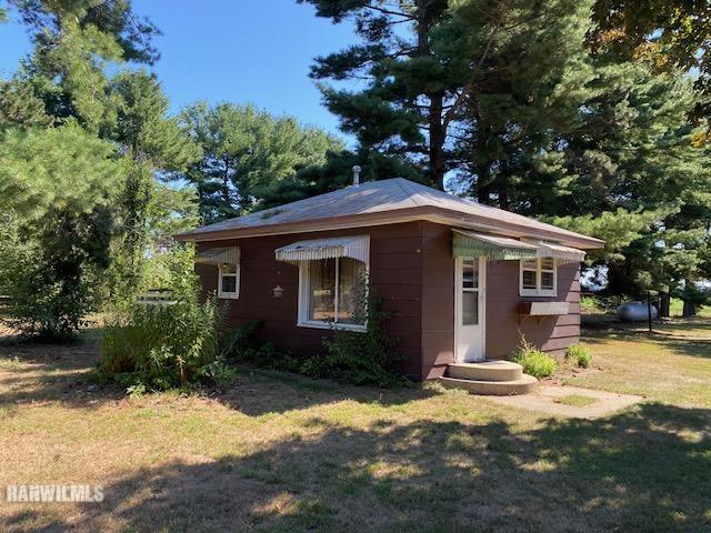 6389 C Riverview Road Thomson, IL 61285 - Photo 2 of 16 a front view of a house with a yard
