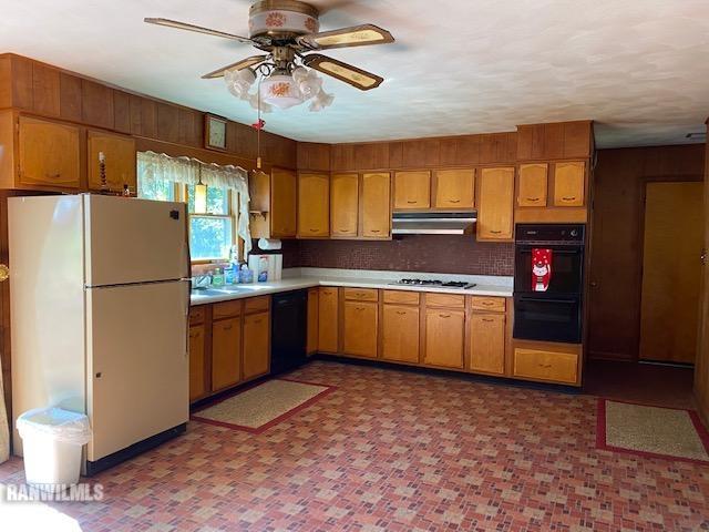 6389 C Riverview Road Thomson, IL 61285 - Photo 4 of 16 a kitchen with a refrigerator a sink and dishwasher
