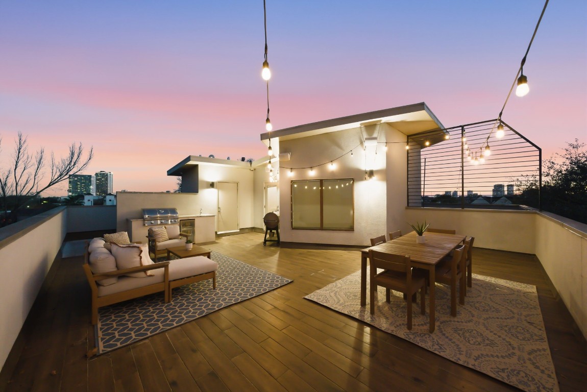 Boasting panoramic Downtown views from 1405 Vermont Street #A, the expansive rooftop deck features a summer kitchen and designer finishes for premier Inner Loop entertaining. Contemporary styling meets luxury with a private seating area and outdoor dining space, all set atop this 3-bedroom Bradford Mews retreat.