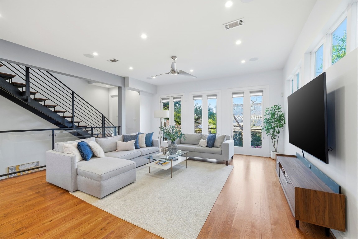 1405 Vermont Street, Unit A Houston, TX 77006 - Photo 12 of 46 a living room with furniture wooden floor and a flat screen tv
