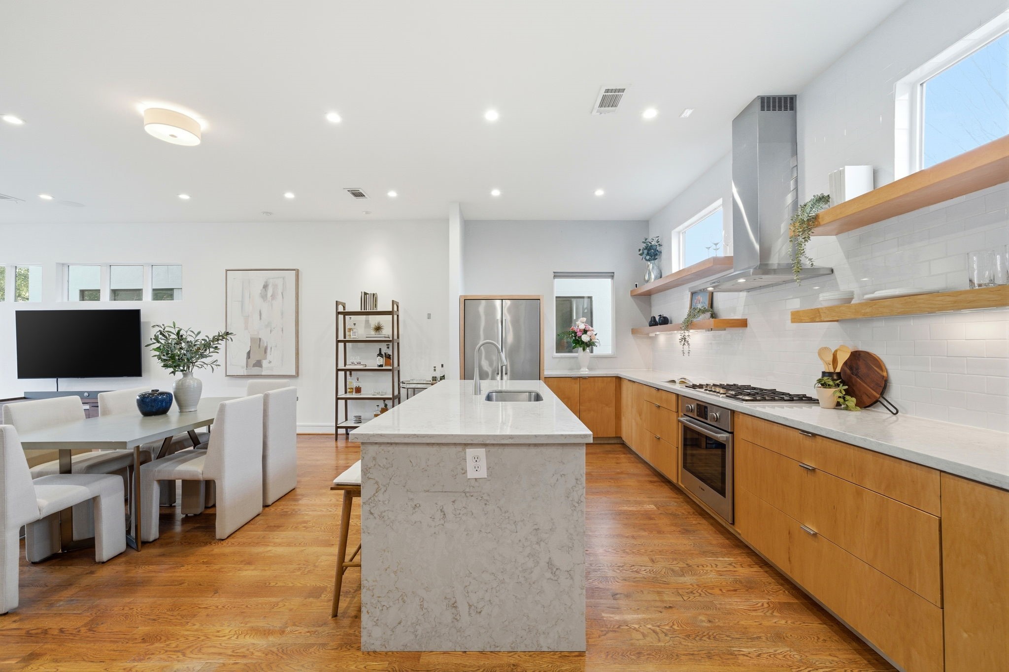 1405 Vermont Street, Unit A Houston, TX 77006 - Photo 15 of 46 a large kitchen with stainless steel appliances kitchen island granite countertop a large center island and a stove