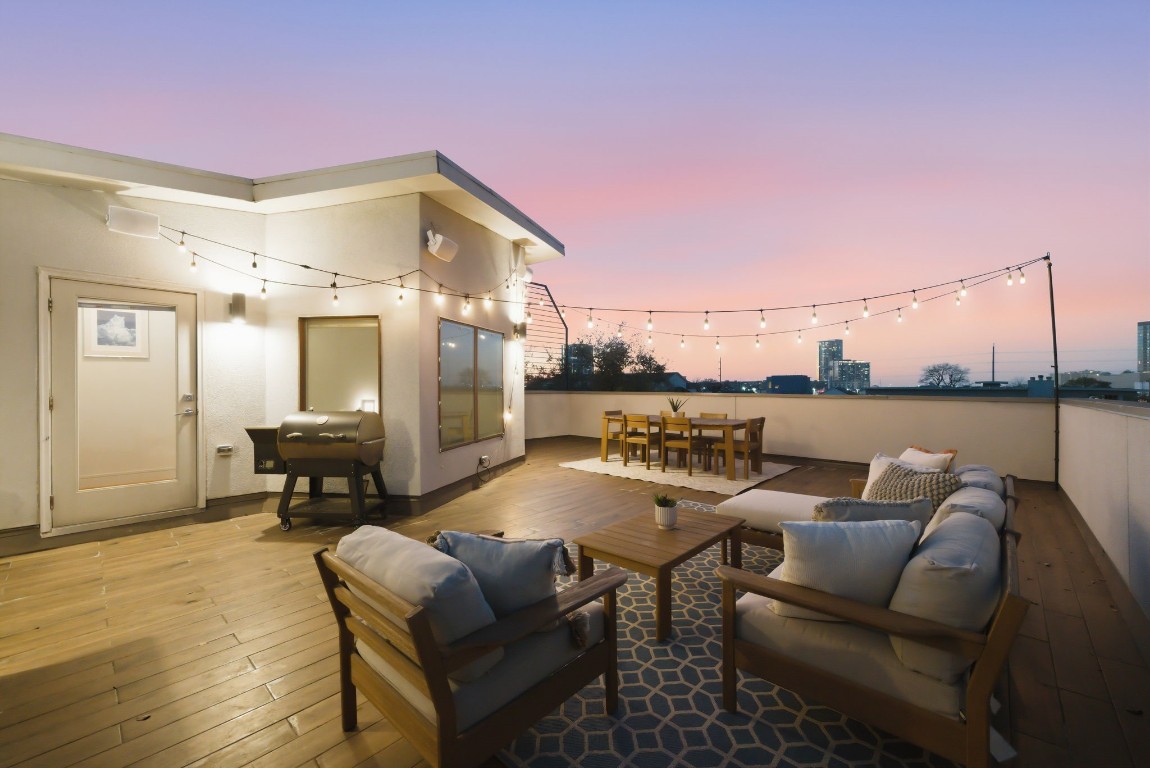 1405 Vermont Street, Unit A Houston, TX 77006 - Photo 7 of 46 a terrace with outdoor seating and city view