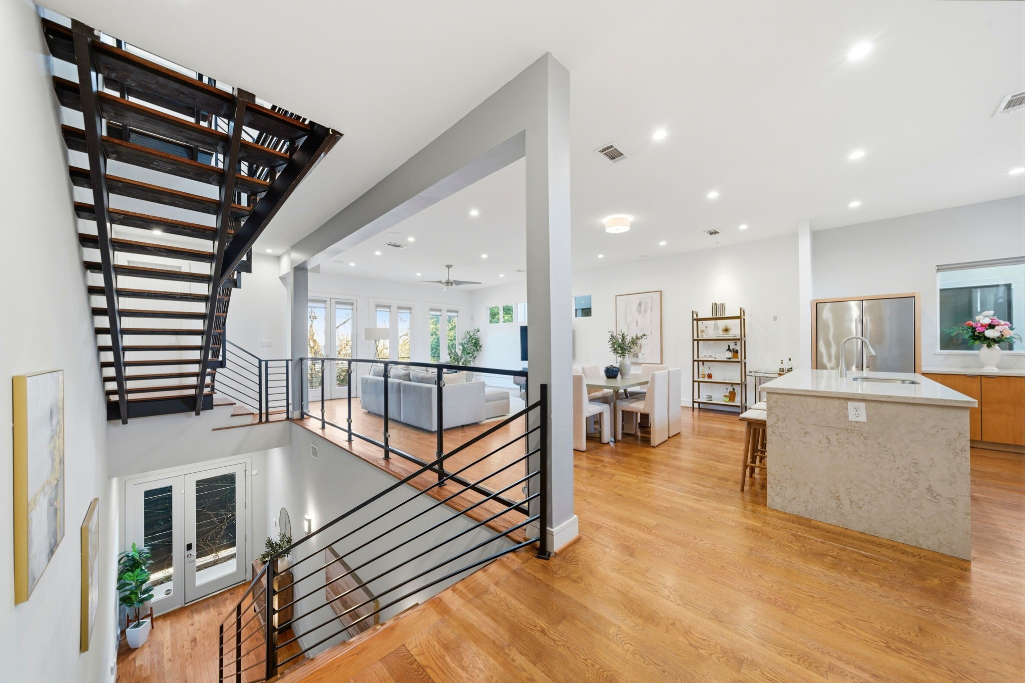 1405 Vermont Street, Unit A Houston, TX 77006 - Photo 10 of 46 a living room with furniture a wooden floor and a large window
