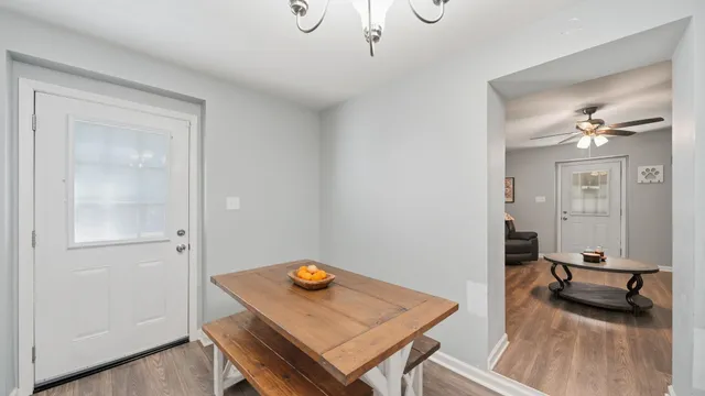 a view of a workspace room with wooden floor