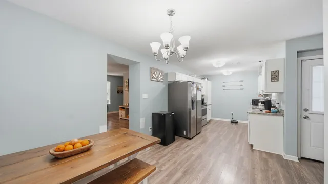 a kitchen with stainless steel appliances a refrigerator and a stove