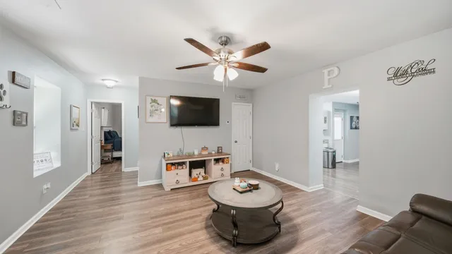 a living room with furniture and a flat screen tv
