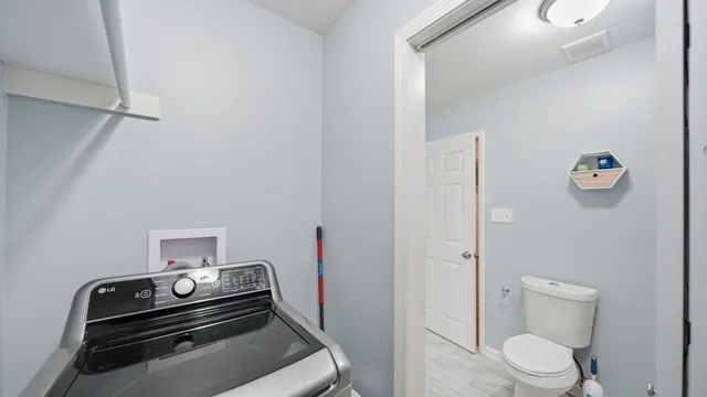 a bathroom with a toilet and a sink