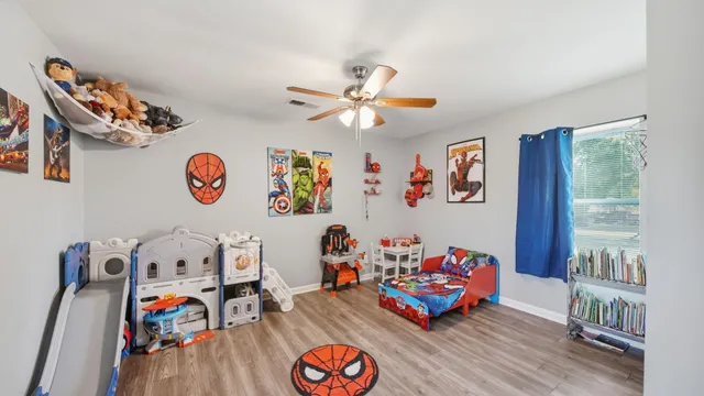 a living room with lots of furniture and toys