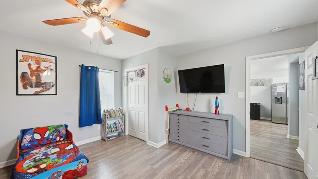 a bathroom with a sink and mirror with toilet