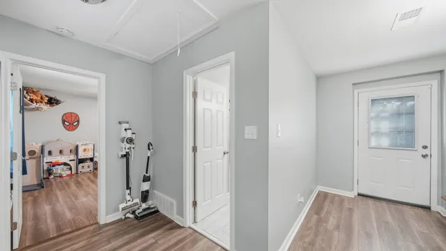 a view of a house with backyard porch and sitting area