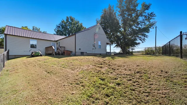 a view of outdoor space with deck and backyard