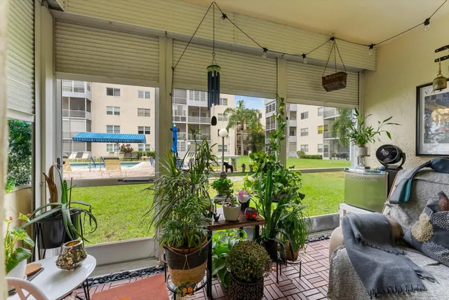 a front view of a house with a garden and patio