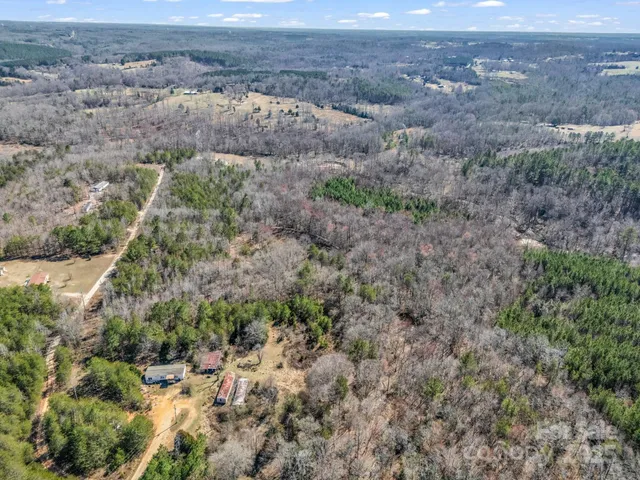 a view of a field with an ocean view