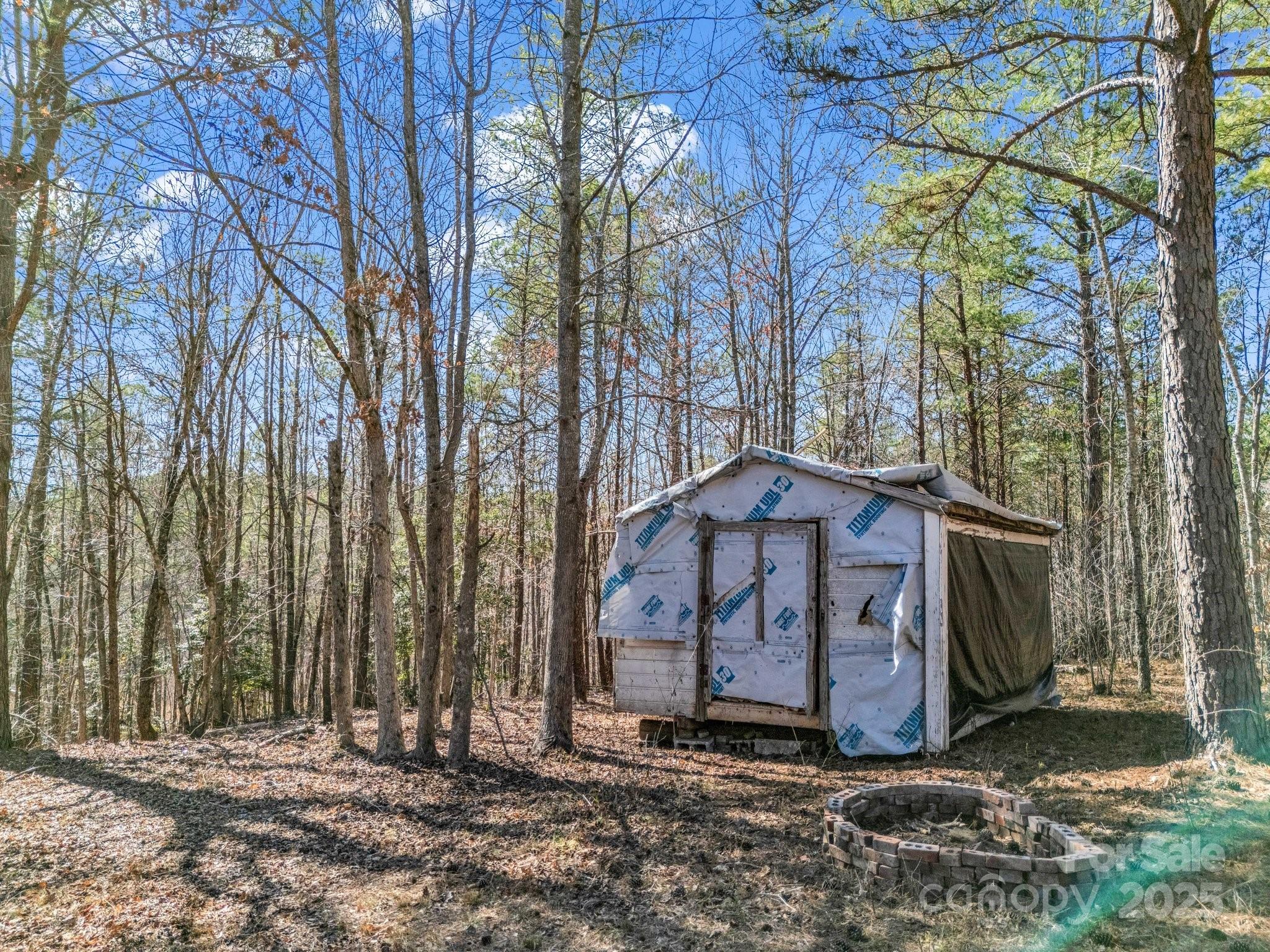 0 Petite Court Rutherfordton, NC 28139 - Photo 10 of 34 a view of a barn with large trees and wooden fence