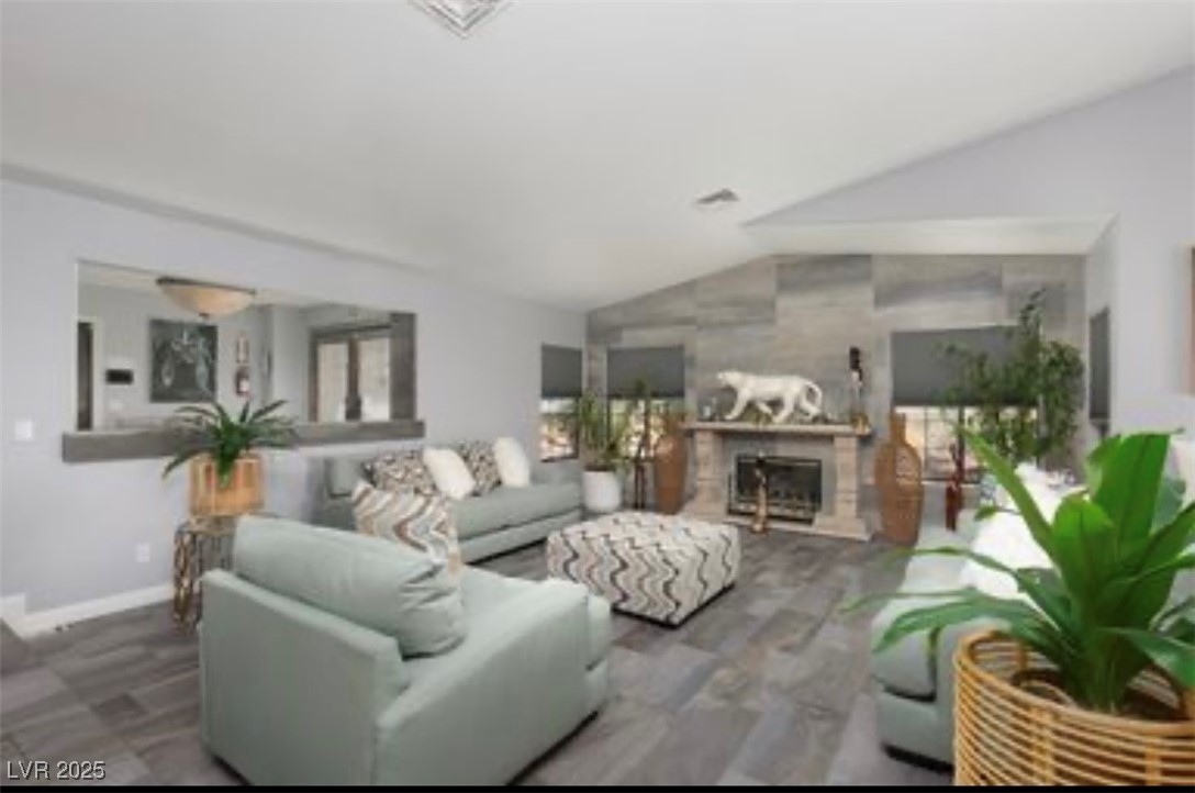 440 Probst Way Las Vegas, NV 89110 - Photo 15 of 42 Living room with lofted ceiling and a fireplace