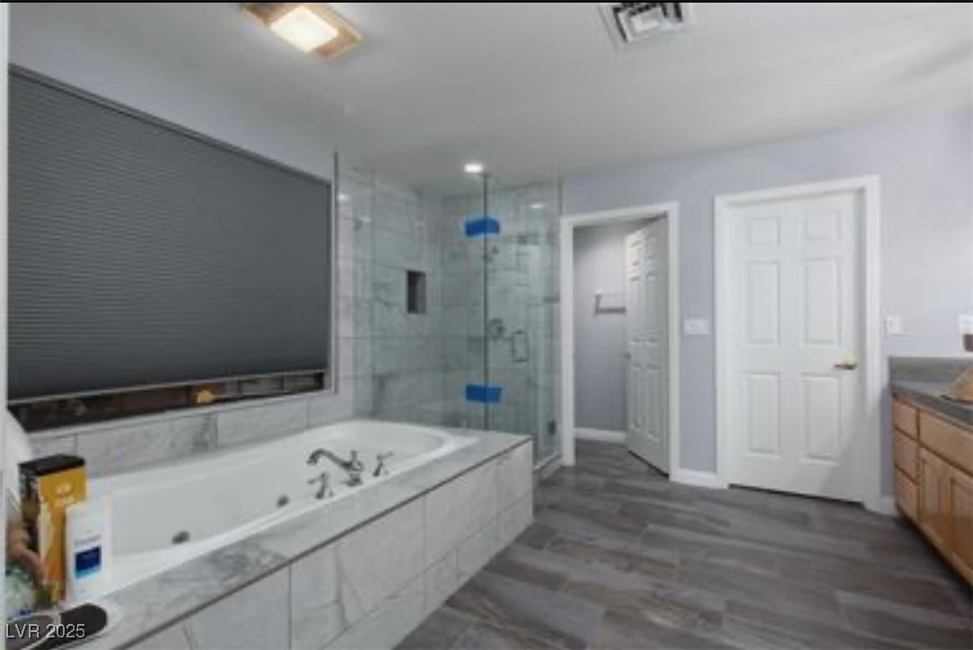 440 Probst Way Las Vegas, NV 89110 - Photo 24 of 42 Bathroom with a shower stall, a whirlpool tub, and vanity