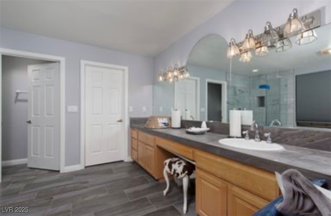 440 Probst Way Las Vegas, NV 89110 - Photo 25 of 42 Bathroom featuring a shower stall and vanity