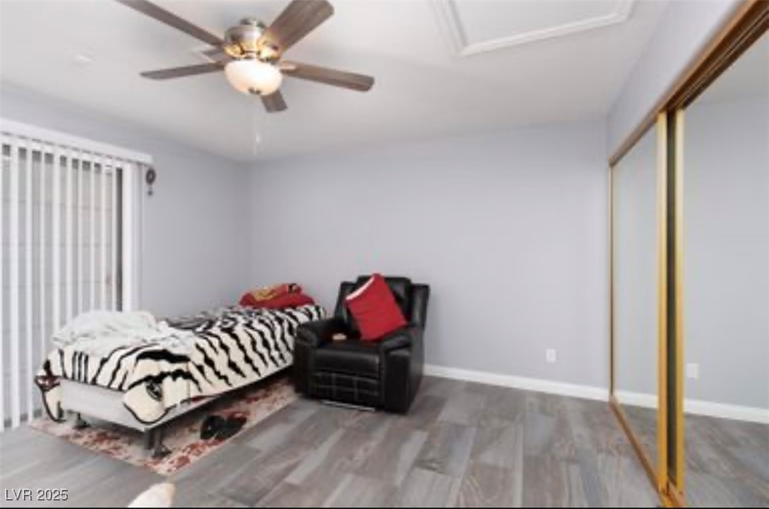 440 Probst Way Las Vegas, NV 89110 - Photo 33 of 42 Bedroom with wood finished floors, a closet, and a ceiling fan