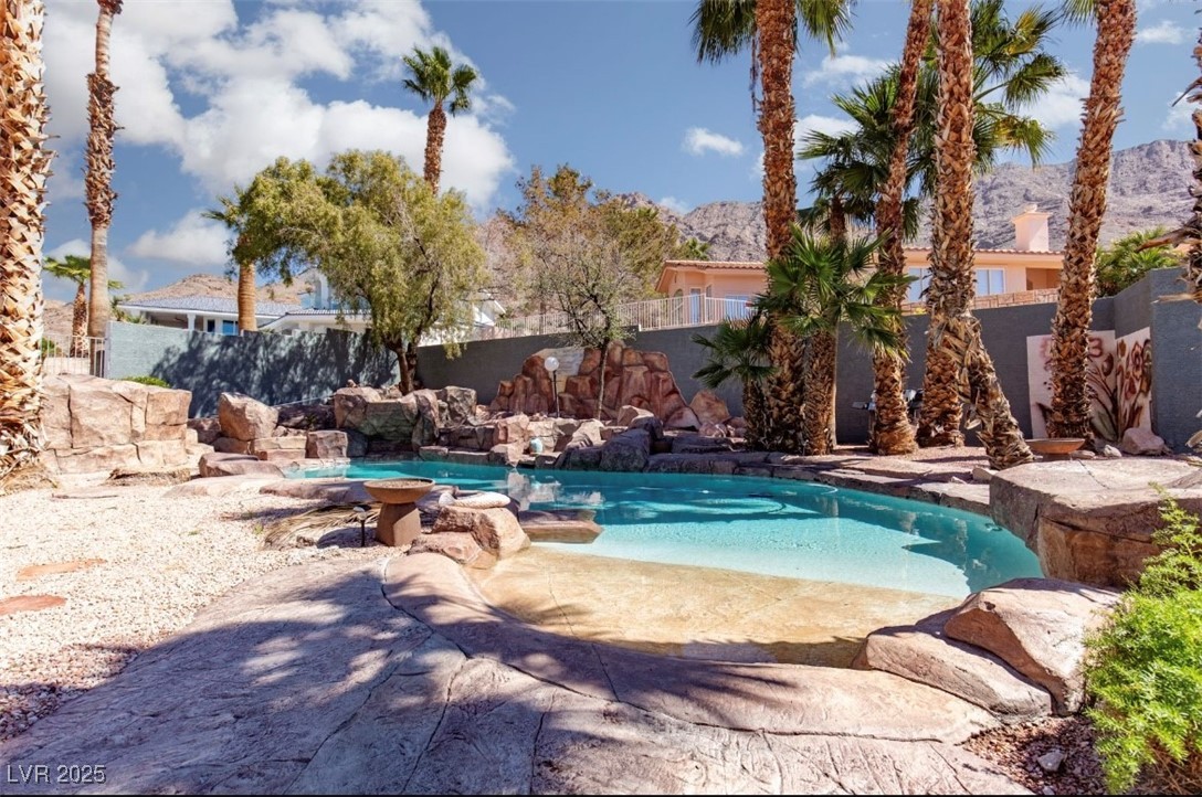 440 Probst Way Las Vegas, NV 89110 - Photo 36 of 42 View of pool featuring a fenced backyard, a mountain view, and a patio