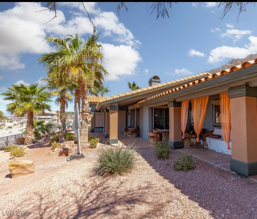440 Probst Way Las Vegas, NV 89110 - Photo 10 of 42 Back of property featuring a patio, a tiled roof, and stucco siding