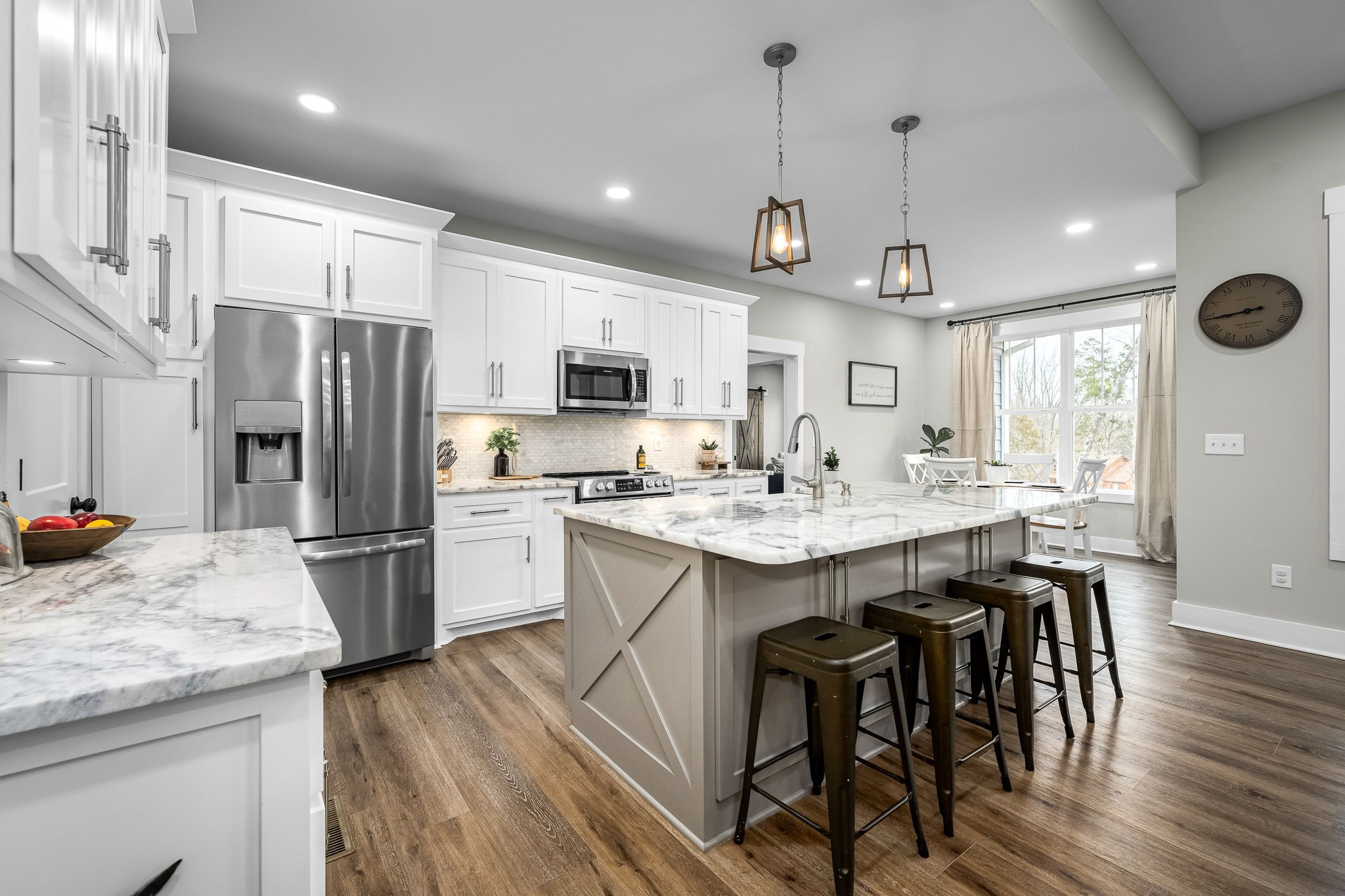 1689 Ridgeview Run Lynchburg, TN 37352 - Photo 18 of 67 a kitchen with kitchen island granite countertop a sink a center island and stainless steel appliances
