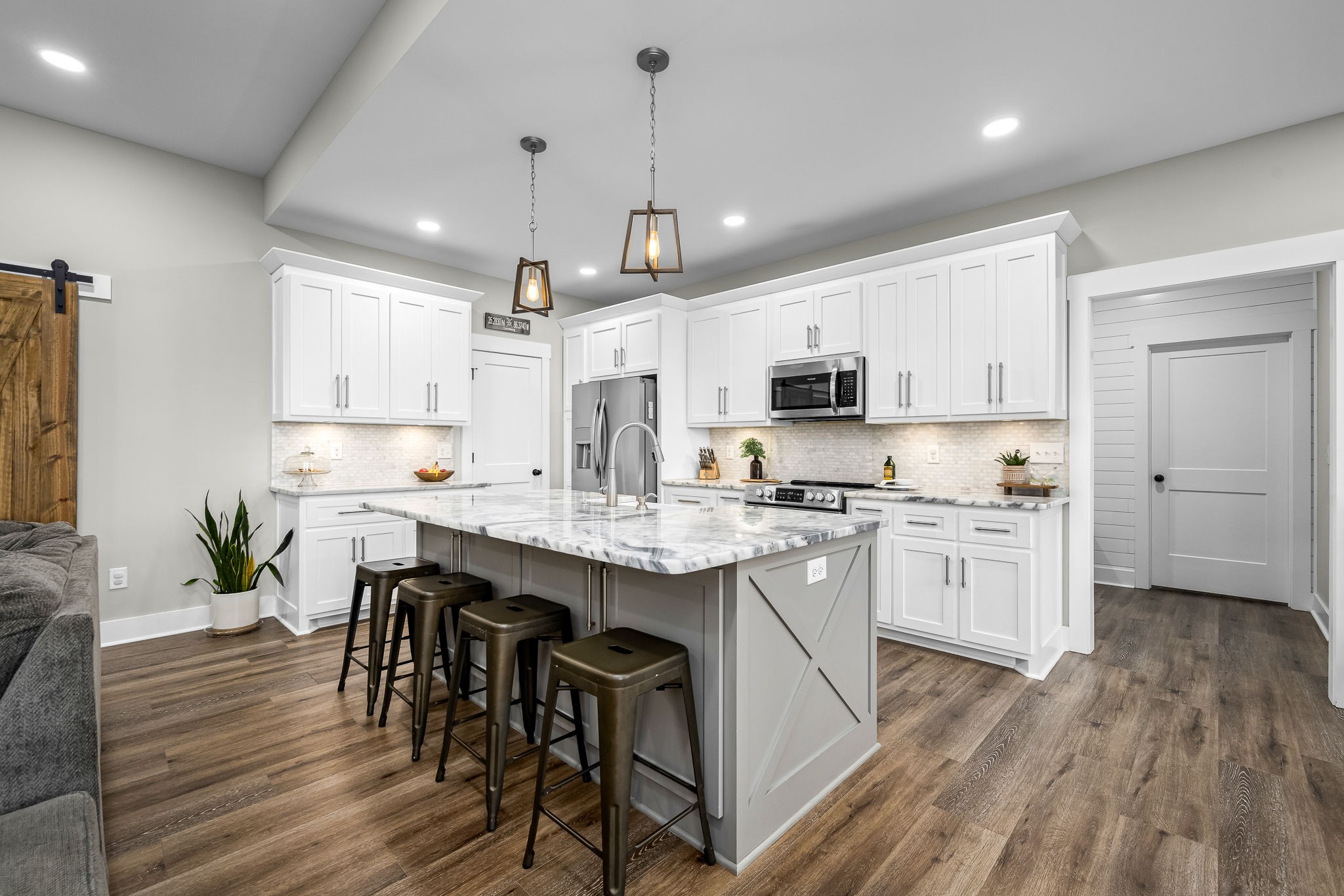 1689 Ridgeview Run Lynchburg, TN 37352 - Photo 20 of 67 a kitchen with kitchen island granite countertop a sink a counter space stainless steel appliances and cabinets