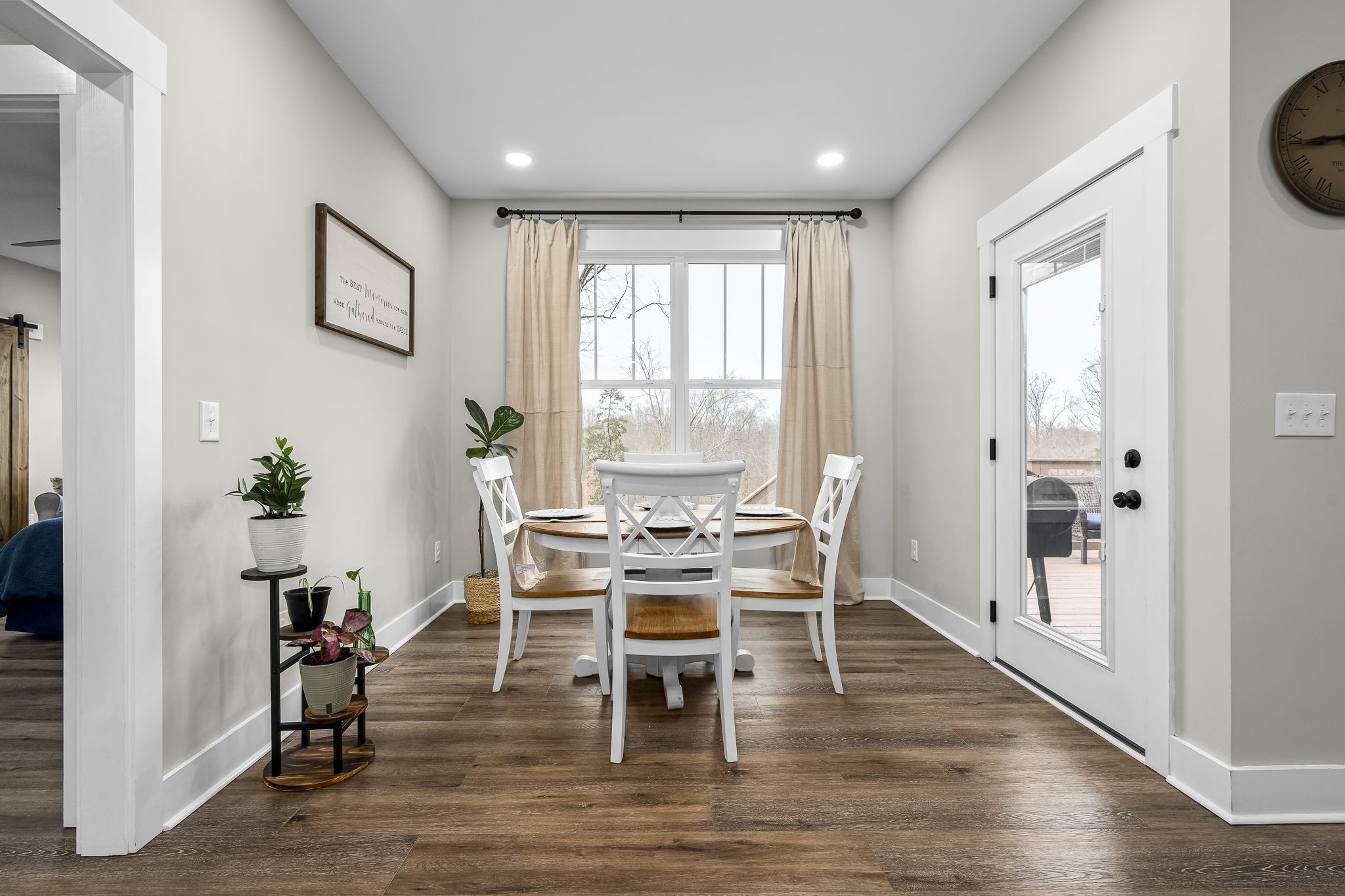 1689 Ridgeview Run Lynchburg, TN 37352 - Photo 23 of 67 a dining room with wooden floor a glass table and chairs