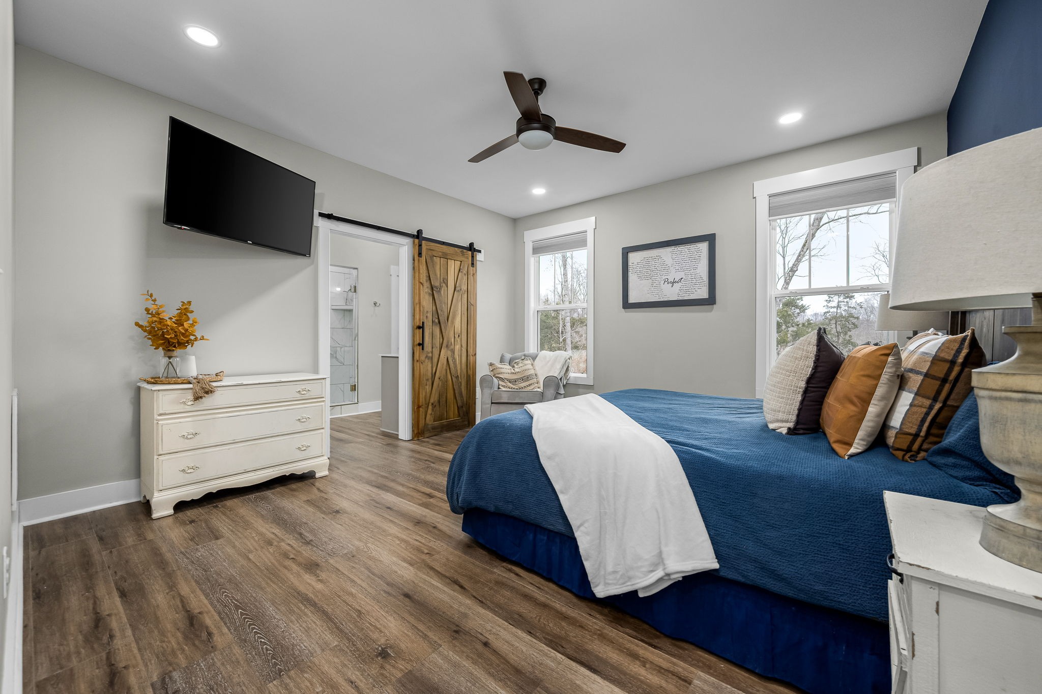 1689 Ridgeview Run Lynchburg, TN 37352 - Photo 25 of 67 a spacious bedroom with a bed and a flat screen tv