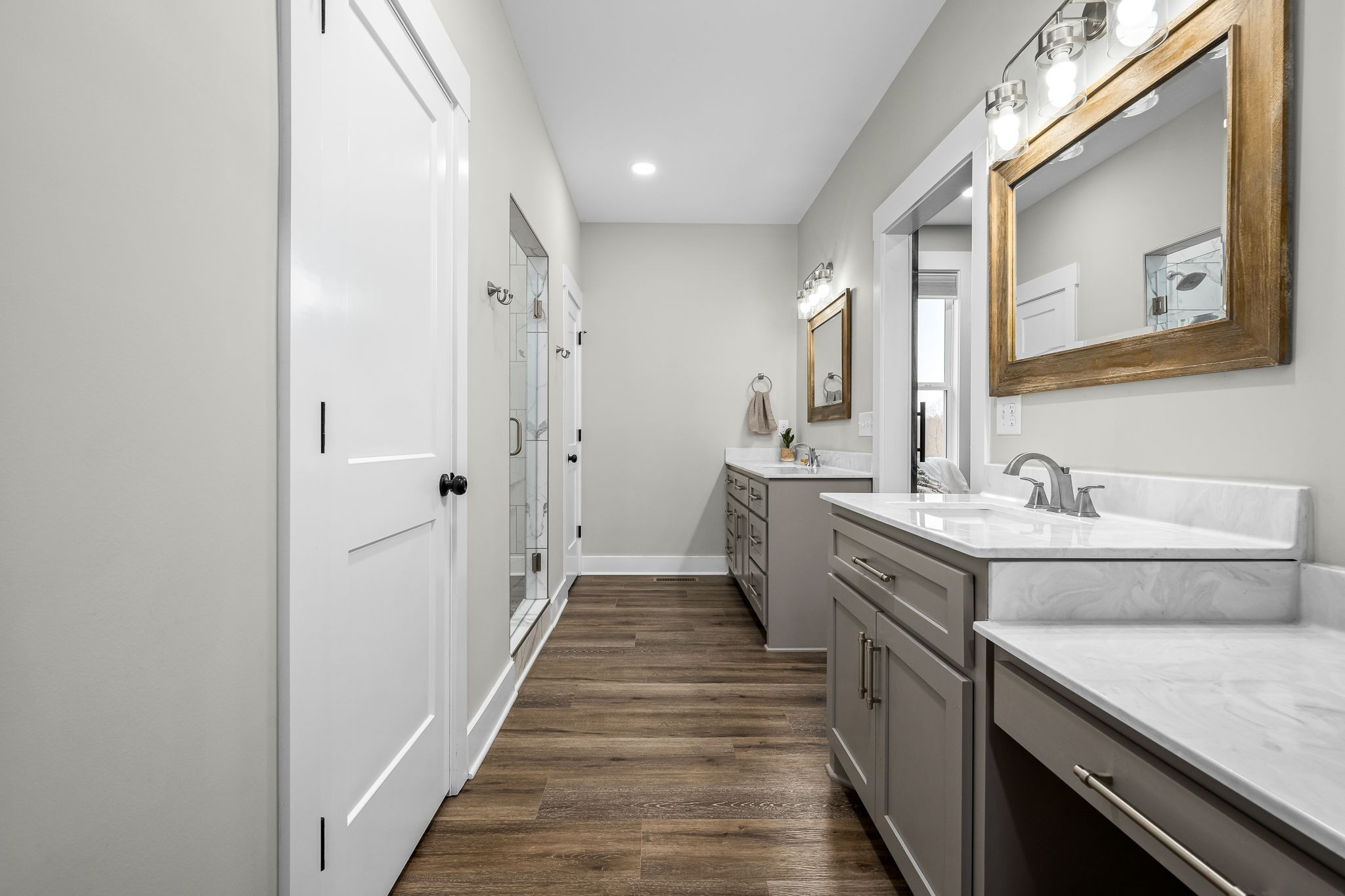 1689 Ridgeview Run Lynchburg, TN 37352 - Photo 28 of 67 a bathroom with a double vanity sink and mirror