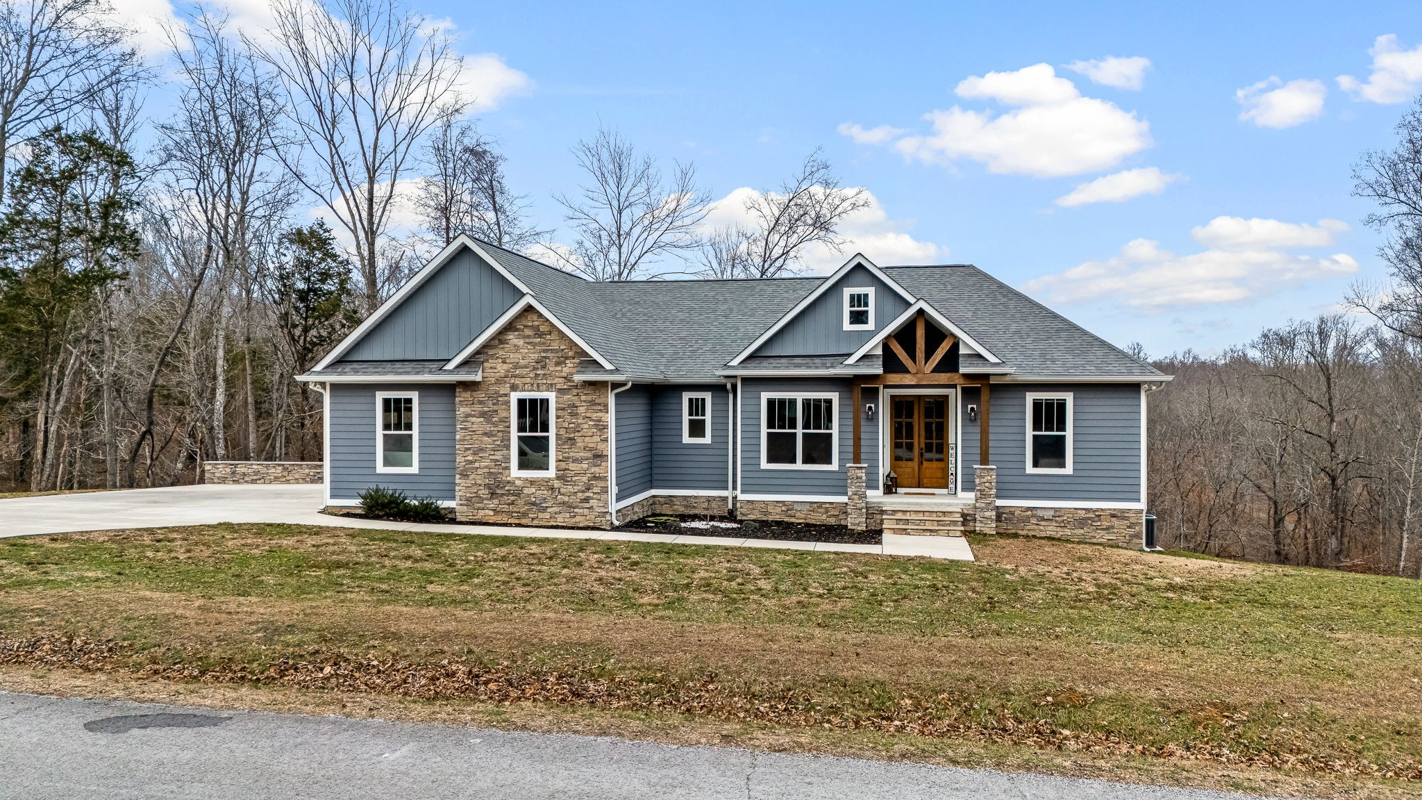 1689 Ridgeview Run Lynchburg, TN 37352 - Photo 3 of 67 a front view of a house with garden
