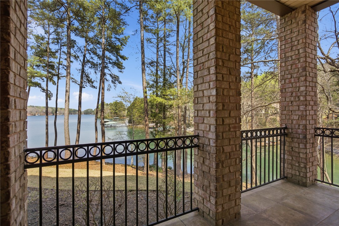 610 Highridge Drive Seneca, SC 29672 - Photo 39 of 50 Enjoy tranquil lake views from this inviting balcony, perfect for serene mornings or peaceful evenings.