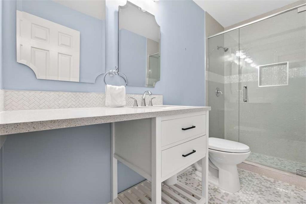 3035 Mt Zion Road Oxford, GA 30054 - Photo 43 of 99 a bathroom with a sink toilet vanity and shower