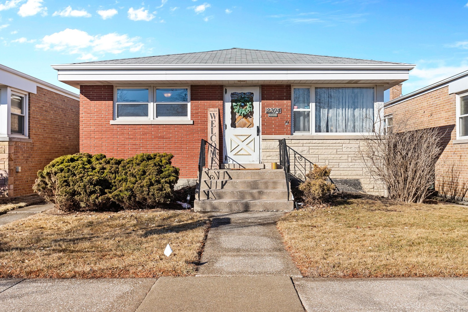 2204 Hainsworth Avenue North Riverside, IL 60546 - Photo 1 of 17 a view of a house with snow on the side of the road