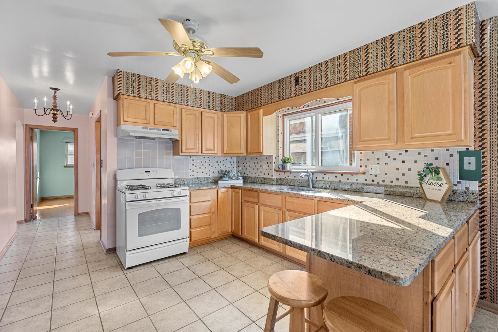 2204 Hainsworth Avenue North Riverside, IL 60546 - Photo 7 of 17 a kitchen with granite countertop a sink stainless steel appliances and cabinets