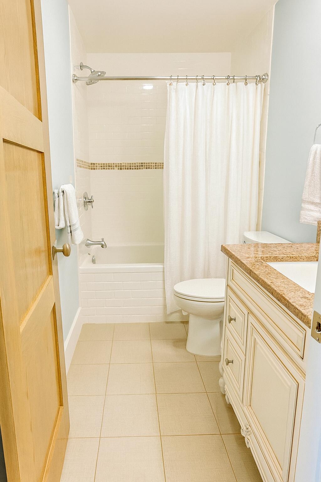 22 Grand Flora Way Santa Rosa Beach, FL 32459 - Photo 11 of 13 a bathroom with a granite countertop sink toilet and shower