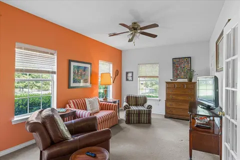 a living room with furniture and a window