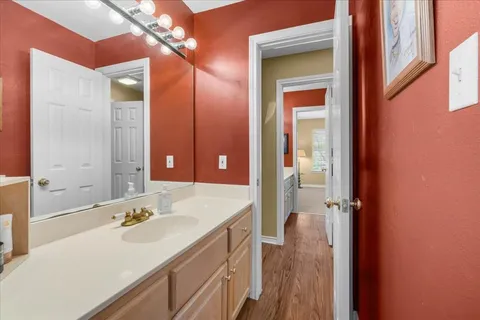 a bathroom with a sink a vanity and a mirror