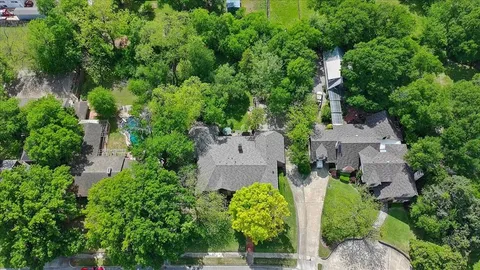 an aerial view of a house with outdoor space and street view