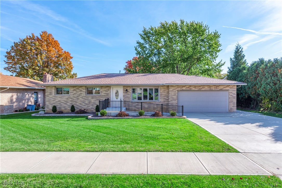 7717 Hoertz Road Cleveland, OH 44134 - Photo 1 of 49 Single story home with a front yard and a garage