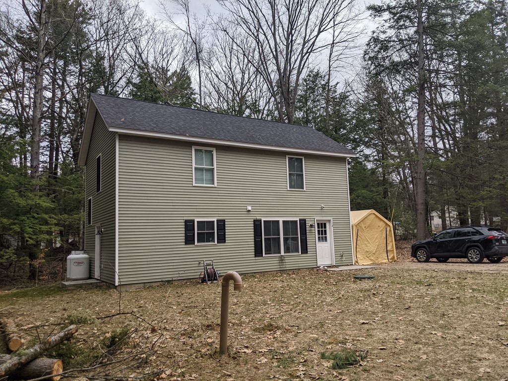 12 Watatic Road Rindge, NH 03461 - Photo 2 of 10 a backyard of a house with sink and barbeque oven