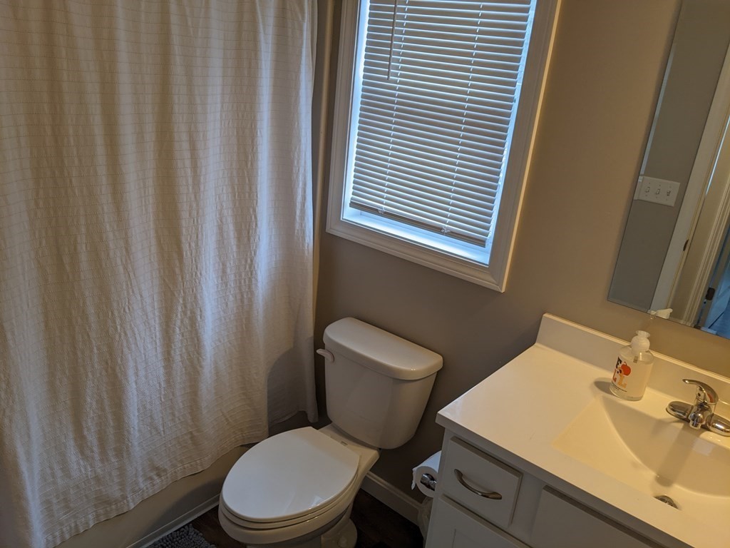 12 Watatic Road Rindge, NH 03461 - Photo 8 of 10 a white toilet sitting next to a bathroom sink